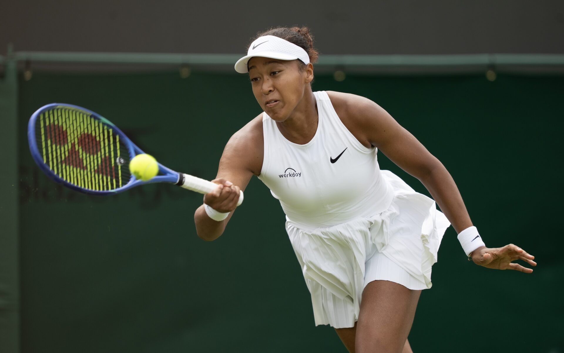 Naomi Osaka of Japan returns a shot during her match against Anastasia Pavlyuchenkova on day five at the All England Lawn Tennis and Croquet Club.