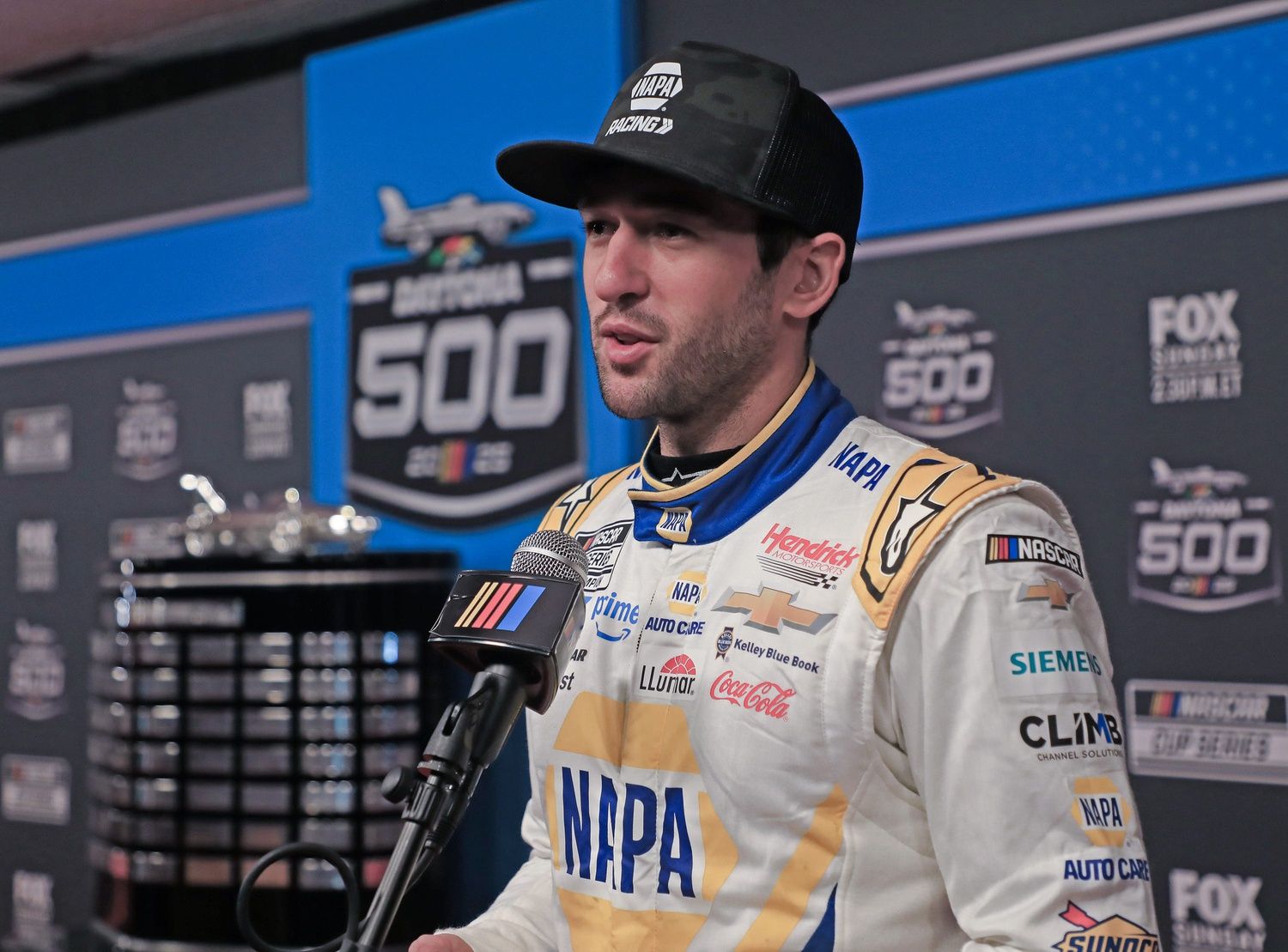 Chase Elliott talks with the press on the red carpet during NASCAR media day on Wednesday, Feb.12, 2025.