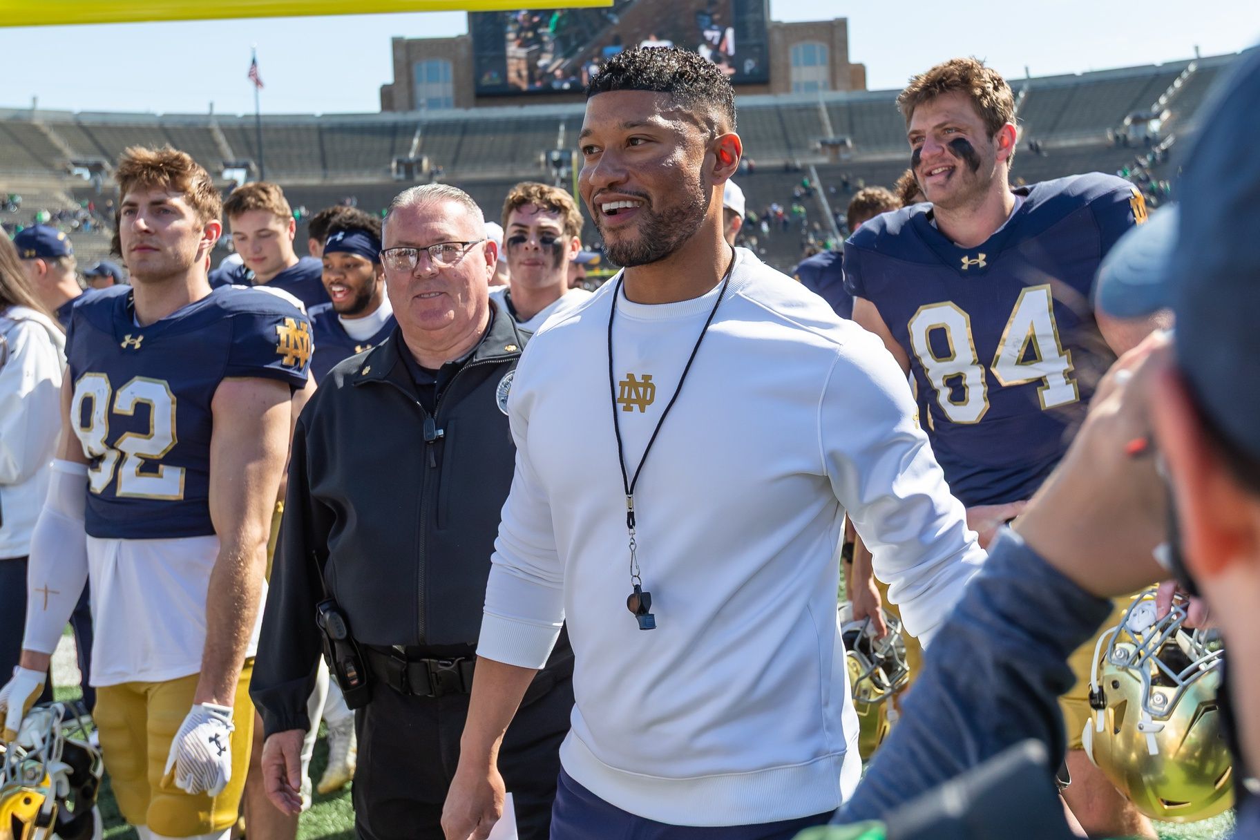 Notre Dame Fighting Irish head coach Marcus Freeman smiles as he walks off the field after the Blue-Gold game at Notre Dame Stadium.