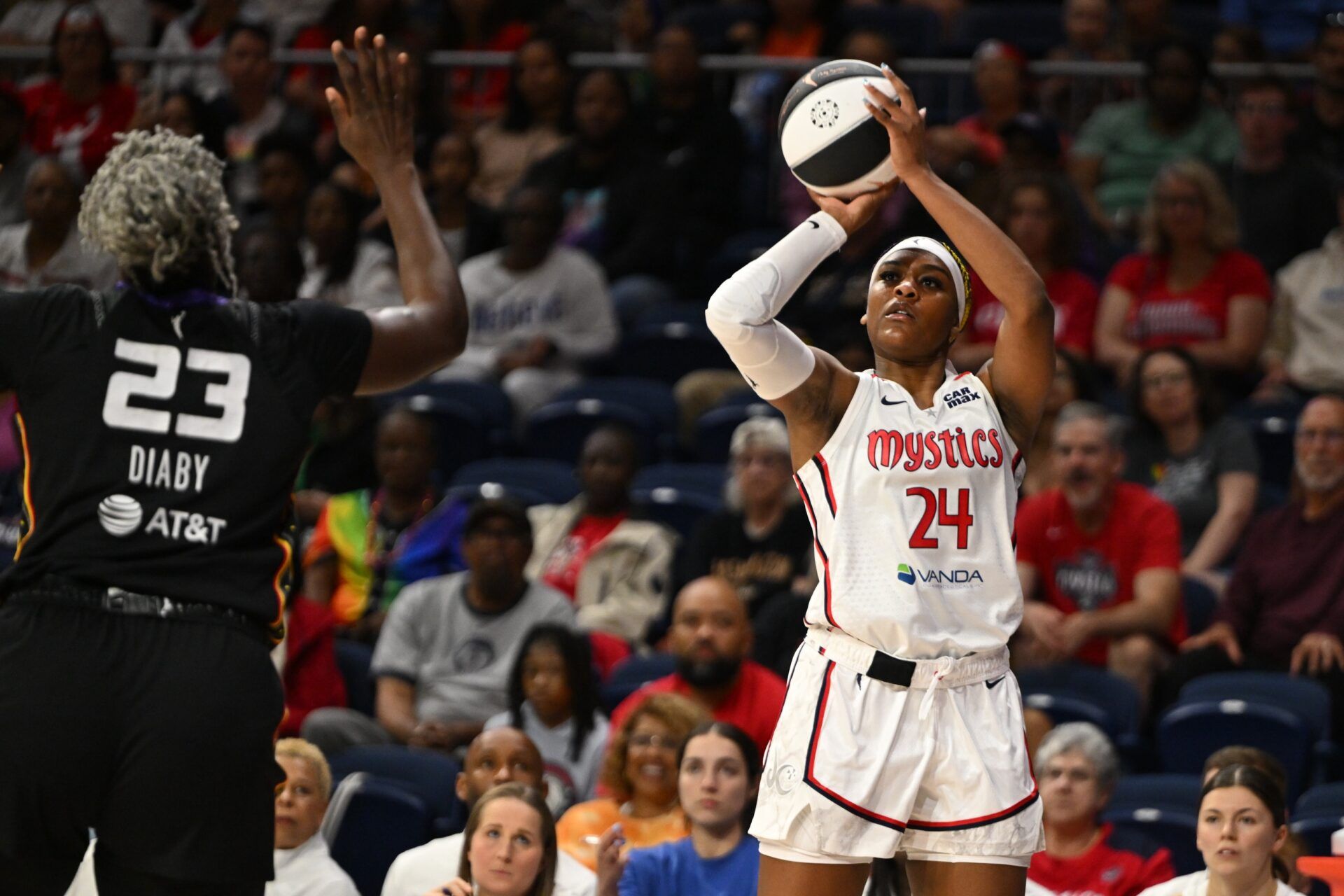 Washington Mystics forward Aaliyah Edwards (24) attempts a jump shot in front of Connecticut Sun center Kariata Diaby (23) during the first quarter at CareFirst Arena.