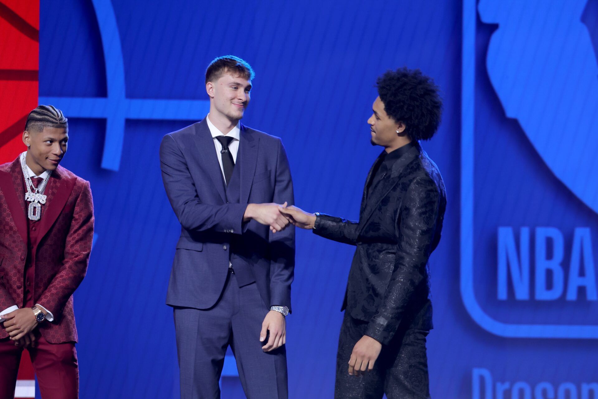 Cooper Flagg and Dylan Harper shake hands on stage before the 2025 NBA Draft at Barclays Center.