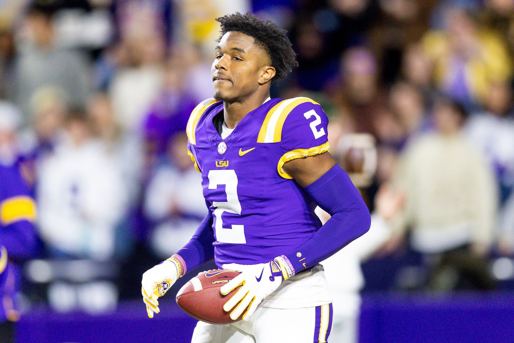 LSU Tigers wide receiver Kyren Lacy (2) hugs head coach Brian Kelly as seniors are being honored during the beginning of the first quarter at Tiger Stadium.