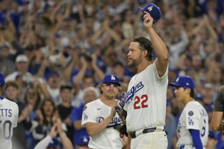 Los Angeles Dodgers starting pitcher Clayton Kershaw (22) tips his cap while walking off the field after throwing the 3000th strikeout pitch to end the sixth inning against the Chicago White Sox at Dodger Stadium.