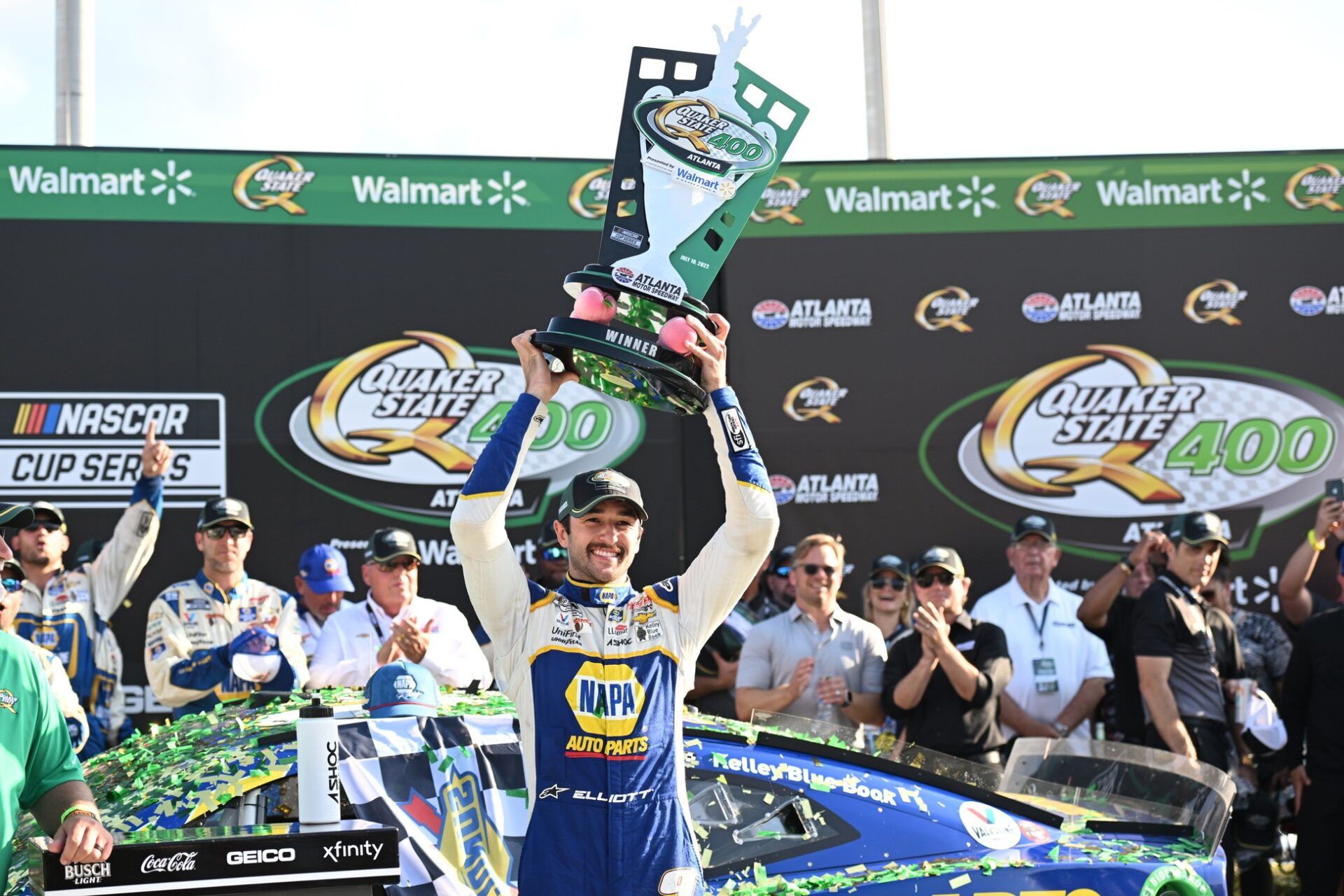 NASCAR Cup Series driver Chase Elliott (9) holds up the trophy after winning the Quaker State 400 at Atlanta Motor Speedway.