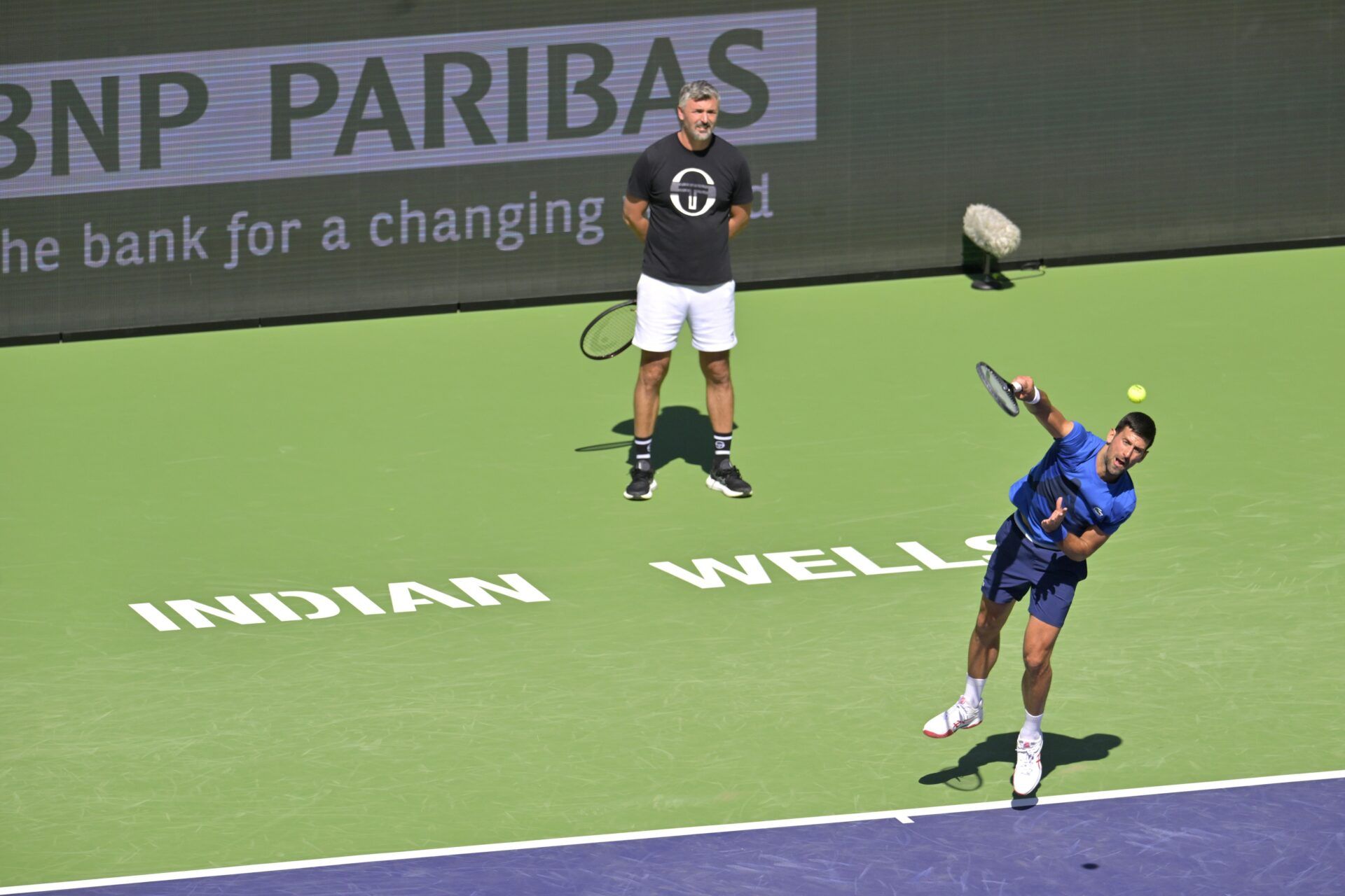 Novak
Djokovic (SRB) practices on stadium court as his coach Goran Ivanisevic looks on during the BNP Paribas Open at the Indian Wells Tennis Garden.