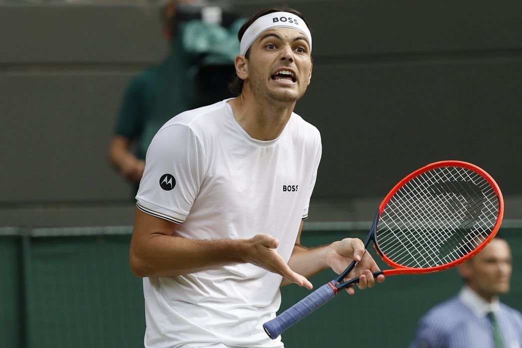 Taylor Fritz (USA) reacts after missing a shot against Lorenzo Musetti (ITA)(not pictured) in a gentlemen's singles quarter final match of The Championships Wimbledon 2024 at The All England Lawn Tennis Club.