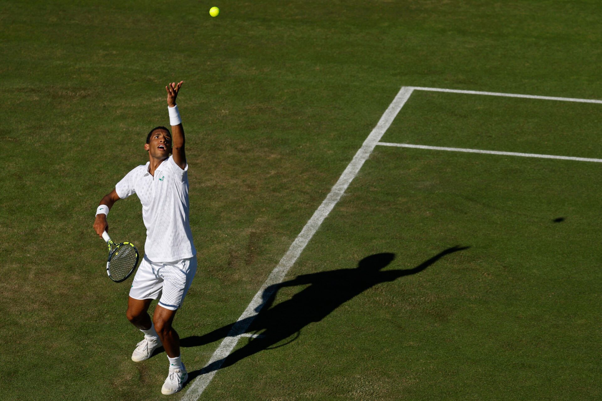 Felix Auger-Aliassime (CAN) serves against James Duckworth (AUS)(not pictured) on day one of The Championships, Wimbledon 2025 at All England Lawn Tennis and Croquet Club.