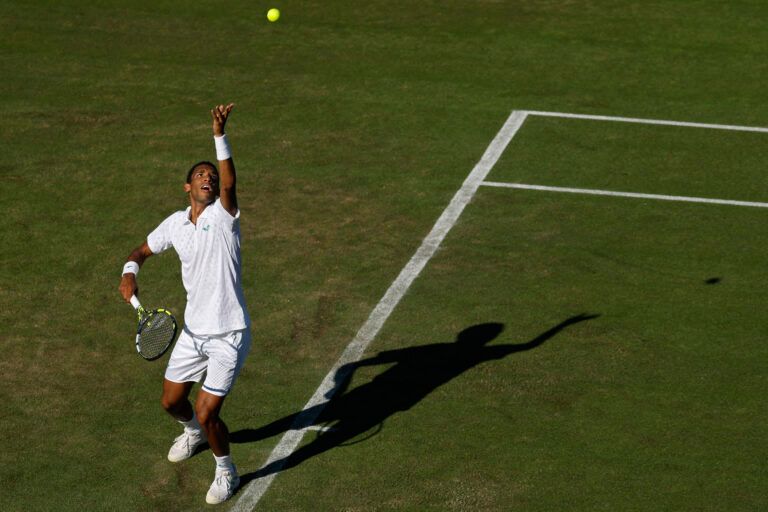 Felix Auger-Aliassime (CAN) serves against James Duckworth (AUS)(not pictured) on day one of The Championships, Wimbledon 2025 at All England Lawn Tennis and Croquet Club.