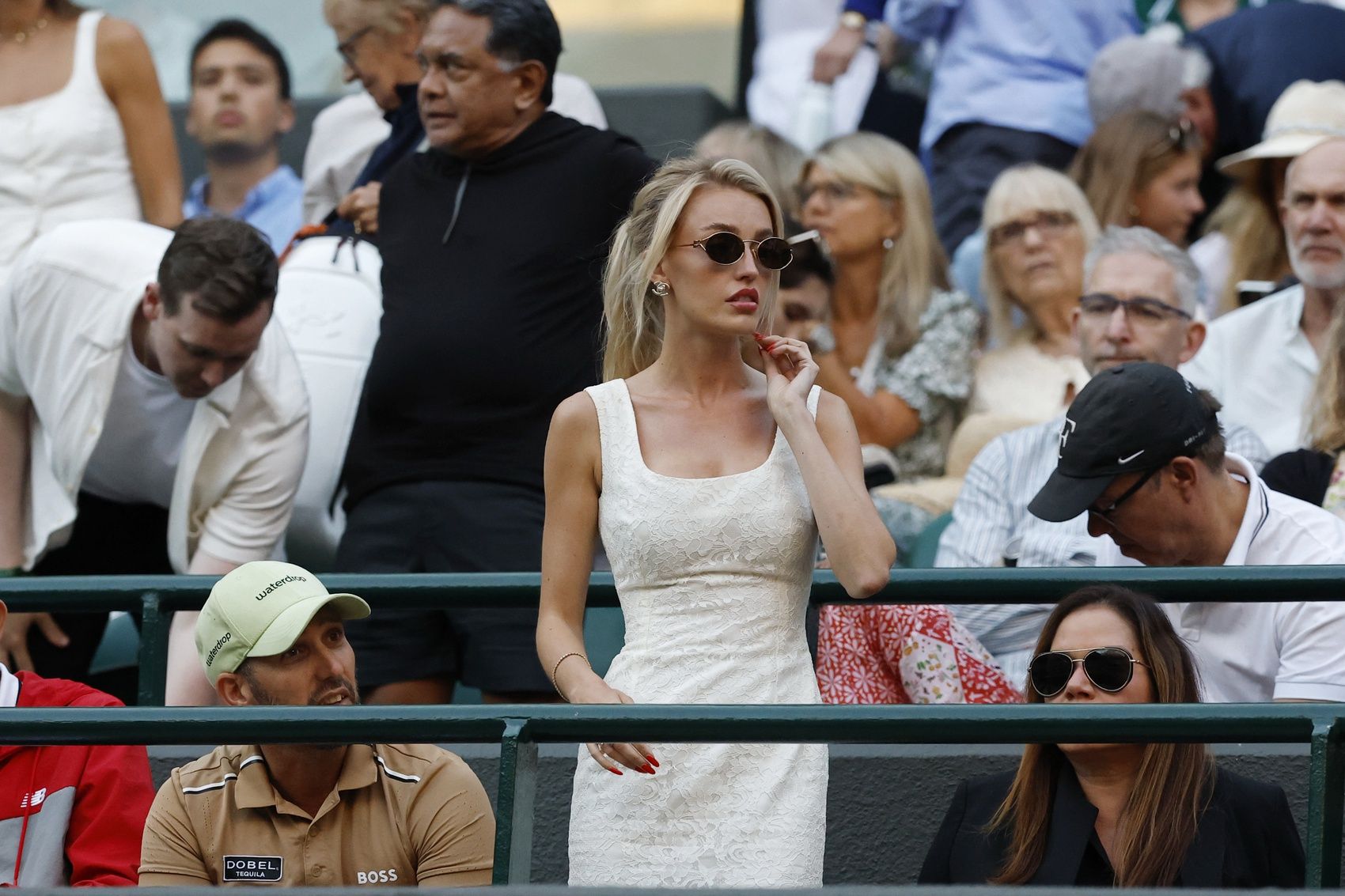 Morgan Riddle, girlfriend of Taylor Fritz (USA)(not pictured), stands in Fritz' player's box during a changeover in the match against  Gabriel Diallo (CAN)(not pictured) on day three of The Championships Wimbledon 2025 at All England Lawn Tennis and Croquet Club.