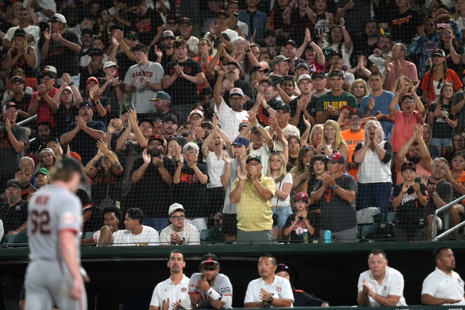 San Francisco Giants fans cheer after pitcher Logan Webb (62) is removed from the game during the seventh inning against the Athletics at Sutter Health Park.