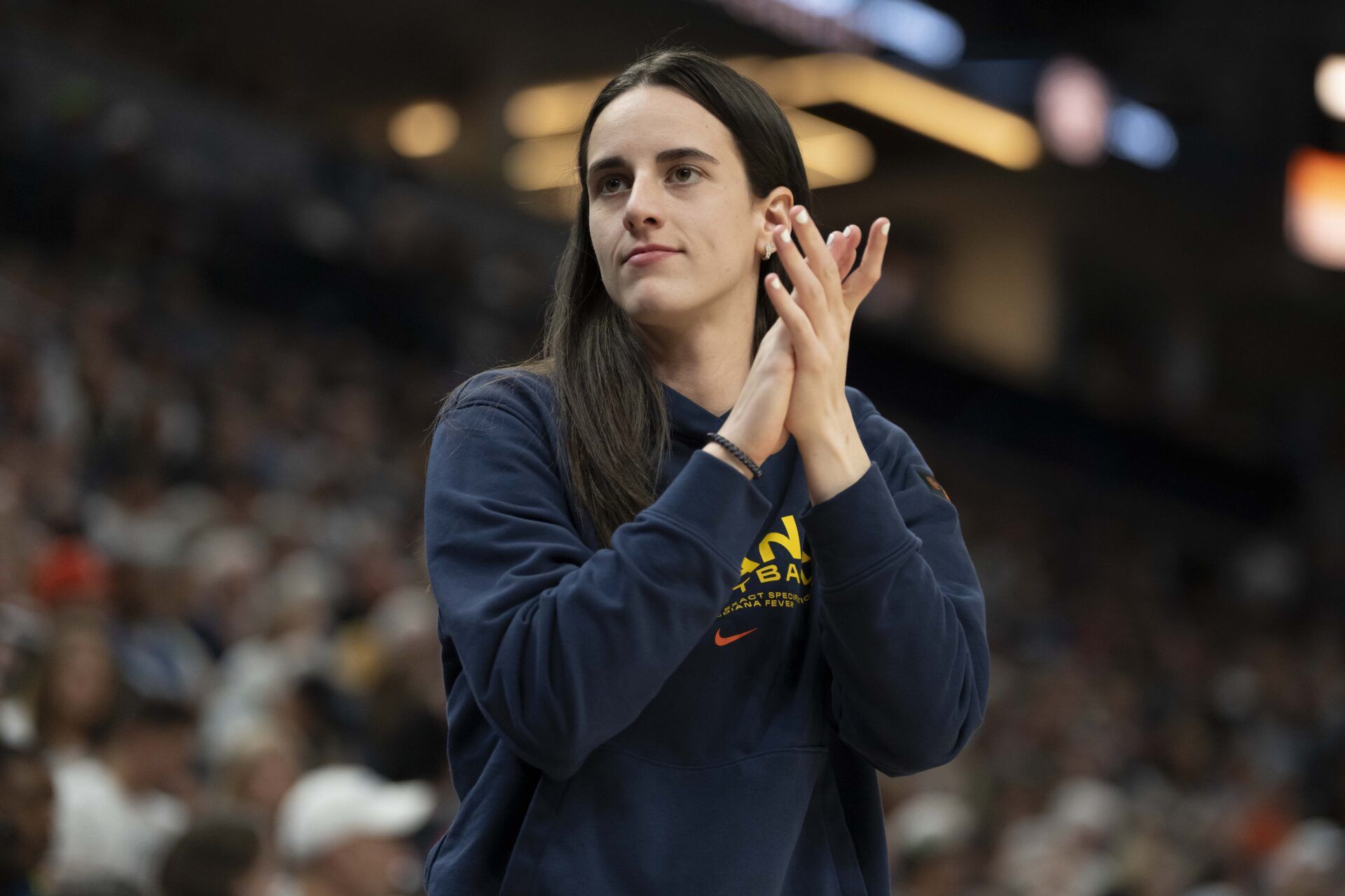 Indiana Fever guard Caitlin Clark (22) looks on against the Minnesota Lynx in the second half during the Commissioner's Cup final at Target Center.