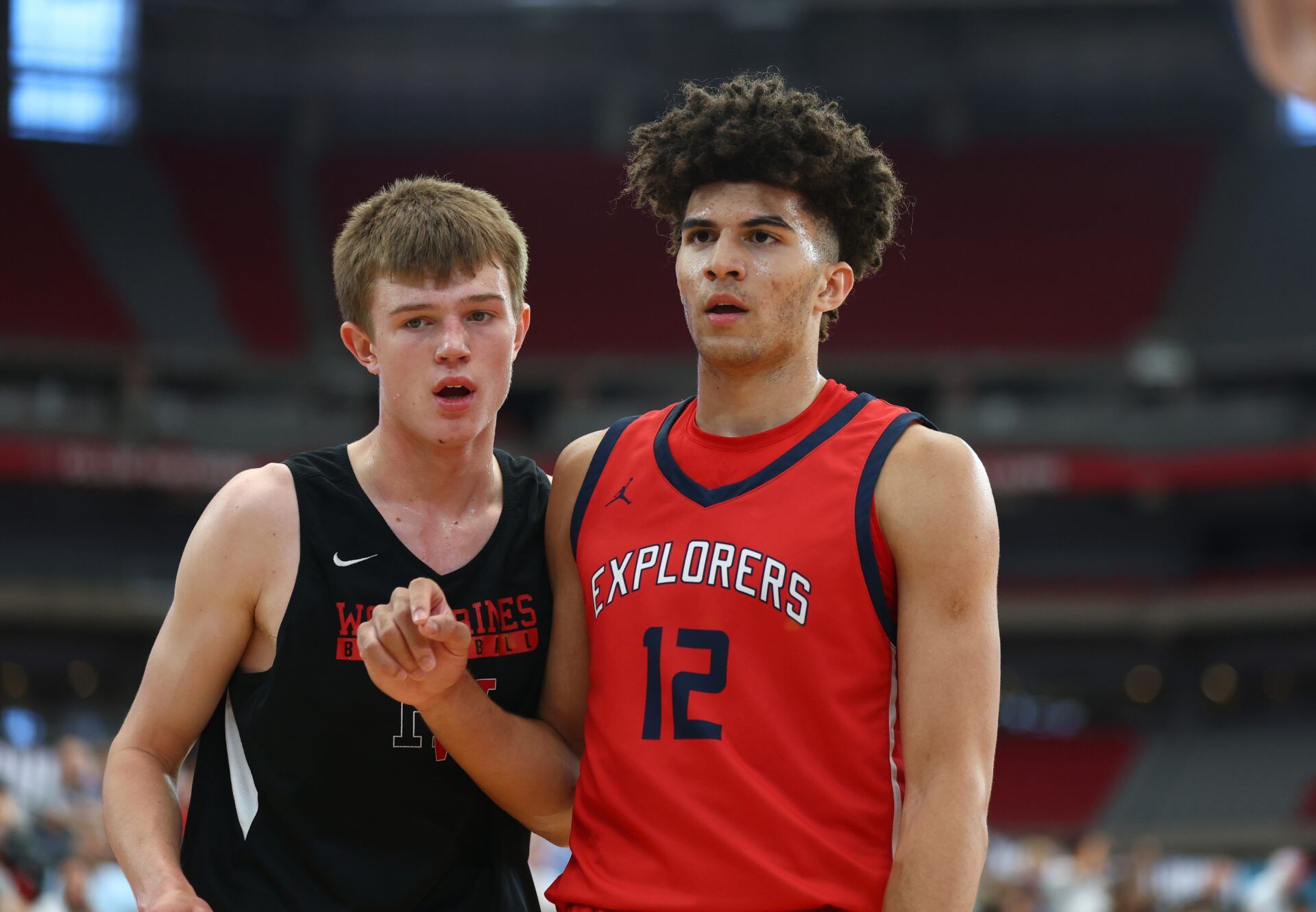 Columbus player Cameron Boozer (12) against Columbus Explorers player Nikolas Khamenia during the Section 7 high school boys tournament at State Farm Stadium.