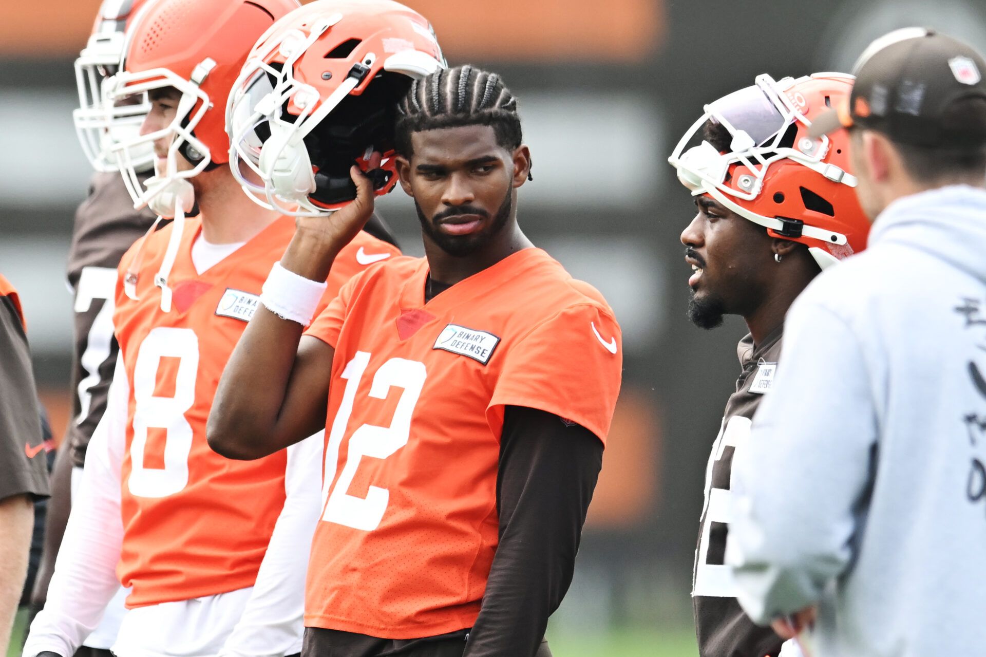 Cleveland Browns quarterback Shedeur Sanders (12) listens to a play call during mini camp at CrossCountry Mortgage Campus.