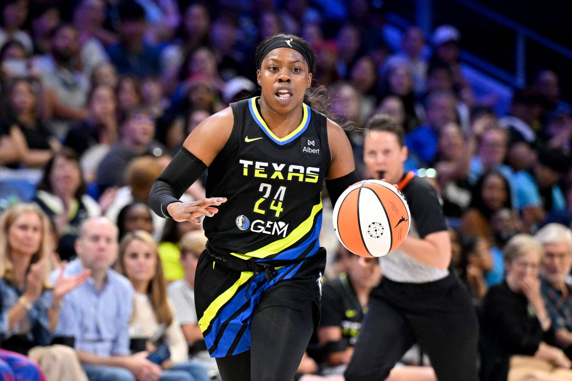 Dallas Wings guard Arike Ogunbowale (24) brings the ball up court against the Washington Mystics during the second half at College Park Center.