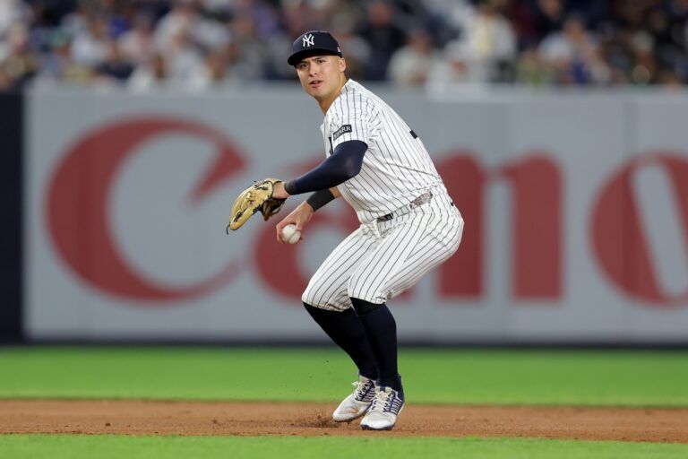 New York Yankees shortstop Anthony Volpe (11) throws out Los Angeles Angels center fielder Jo Adell (not pictured) on a ground ball during the eighth inning at Yankee Stadium.