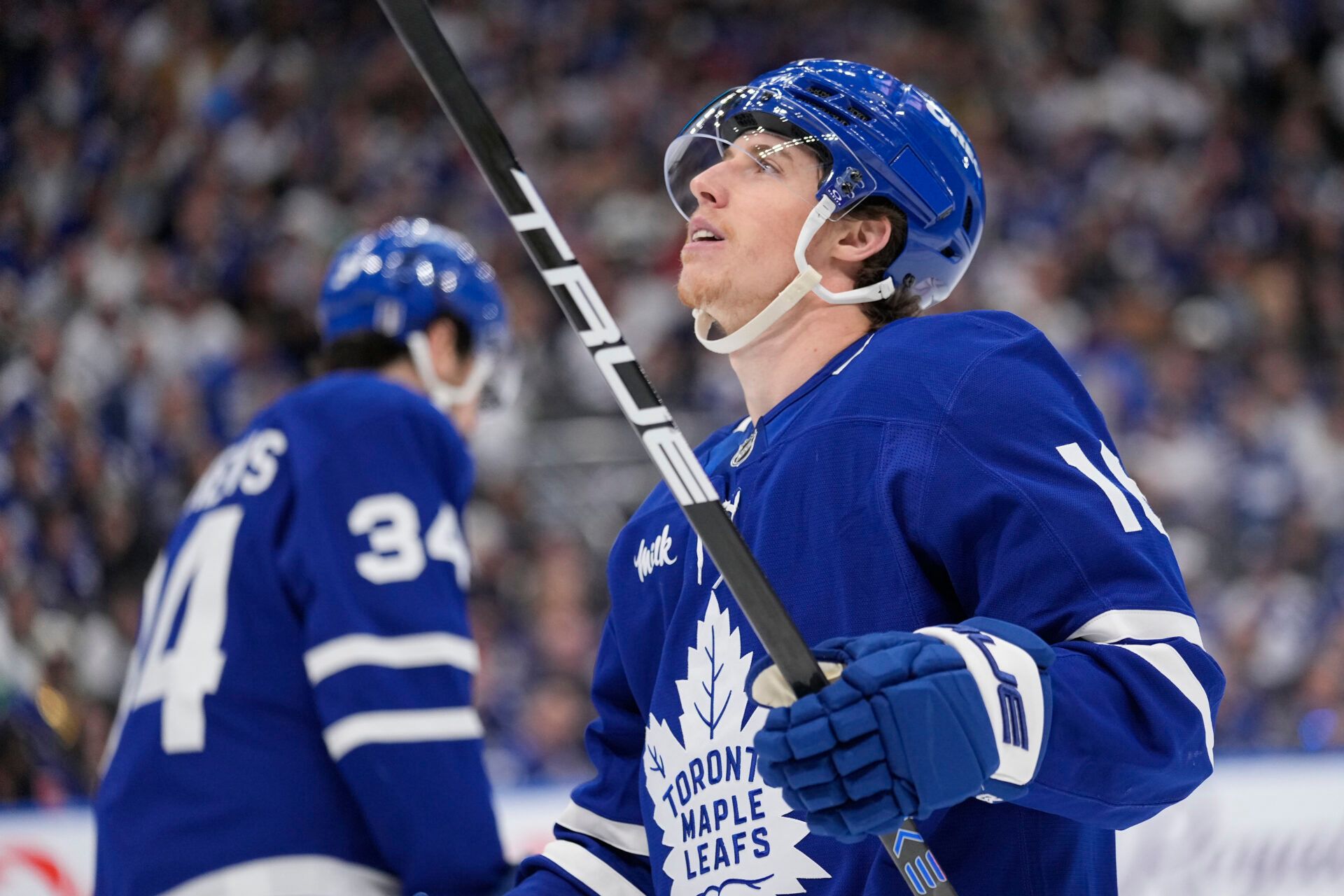 Toronto Maple Leafs forward Mitch Marner (16) looks up at the scoreboard as Toronto Maple Leafs forward Auston Matthews (34) skates to the bench during the third period of game seven of the second round of the 2025 Stanley Cup Playoffs against the Florida Panthers at Scotiabank Arena.