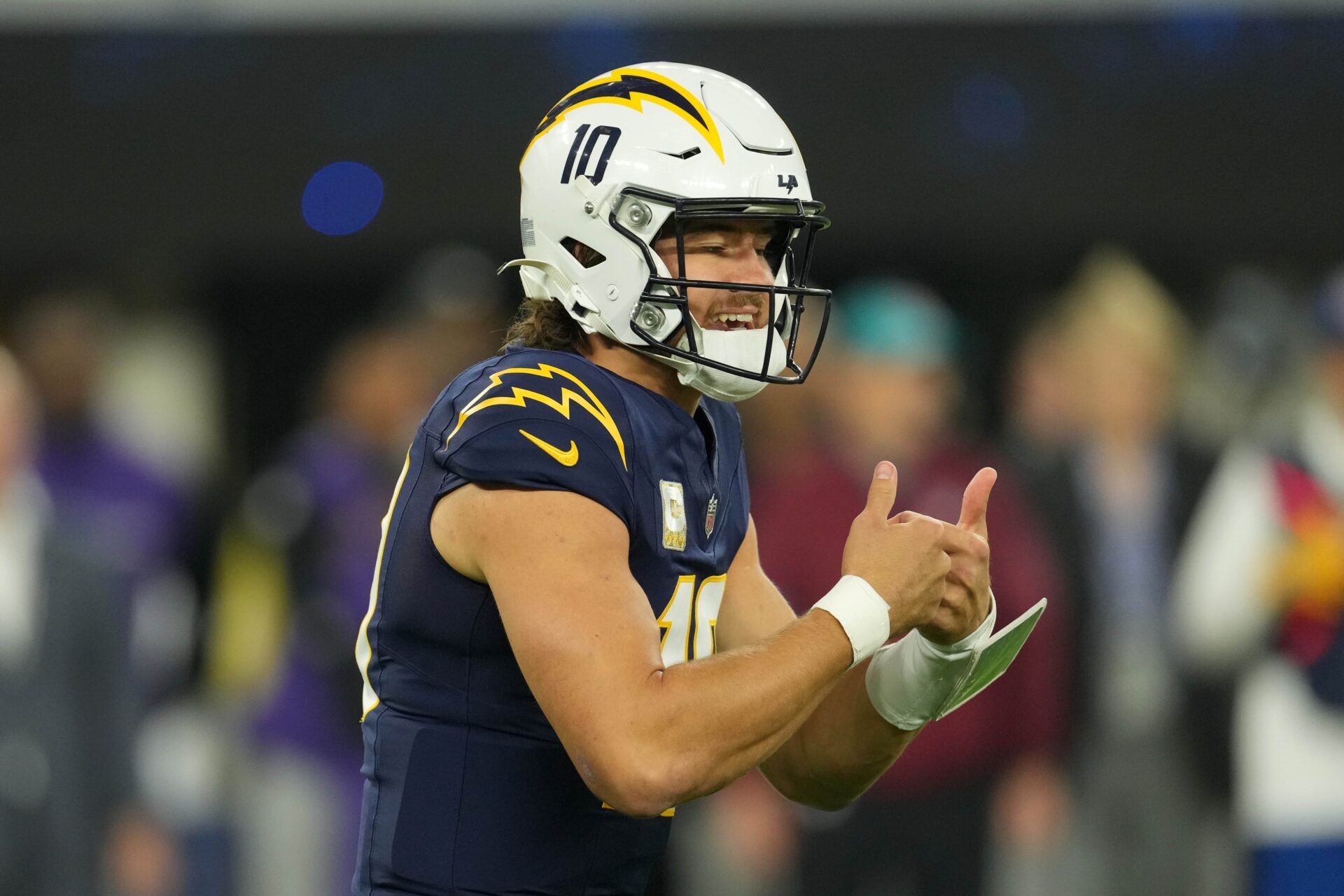 Los Angeles Chargers quarterback Justin Herbert (10) reacts against the Baltimore Ravens in the first half at SoFi Stadium.