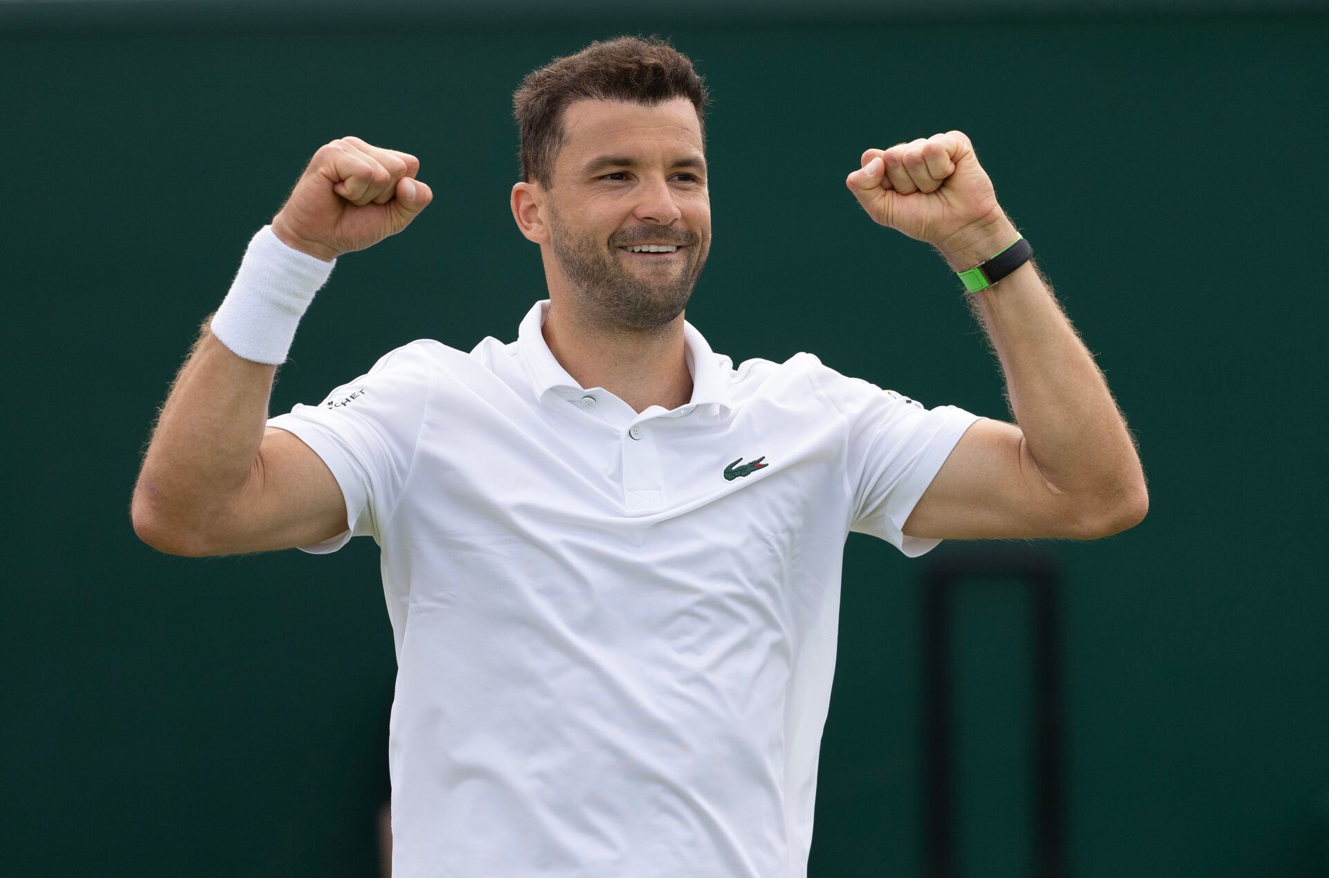 Grigor Dimitrov of Bulgaria celebrates winning his match against Juncheng Shang of China (not shown) on day four of The Championships at All England Lawn Tennis and Croquet Club.