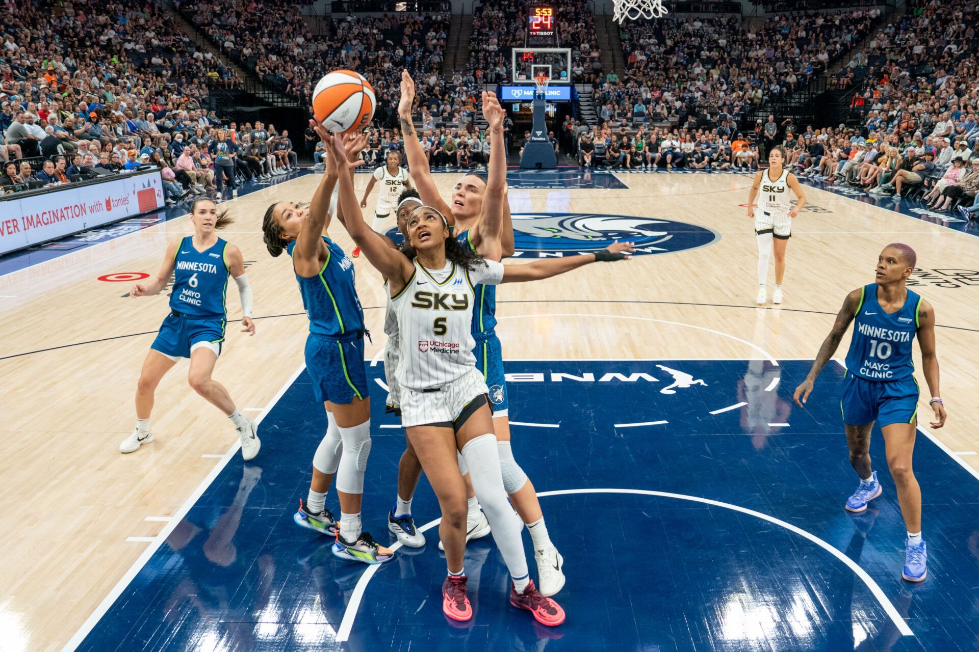 Chicago Sky forward Angel Reese (5) comes down with the rebound in a pack of Minnesota Lynx players in the fourth quarter at Target Center.