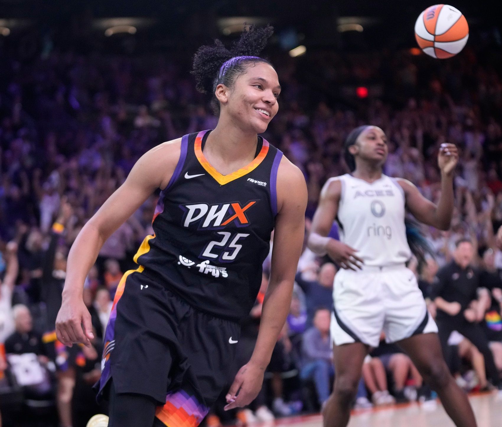 Phoenix Mercury forward Alyssa Thomas (25) smiles after a layup against Las Vegas Aces guard Jackie Young (0) during the fourth quarter at PHX Arena Jun 29, 2025.