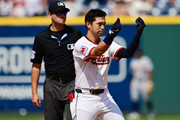 Cleveland Guardians left fielder Steven Kwan (38) celebrates after hitting an RBI double during the eighth inning against the Detroit Tigers at Progressive Field.