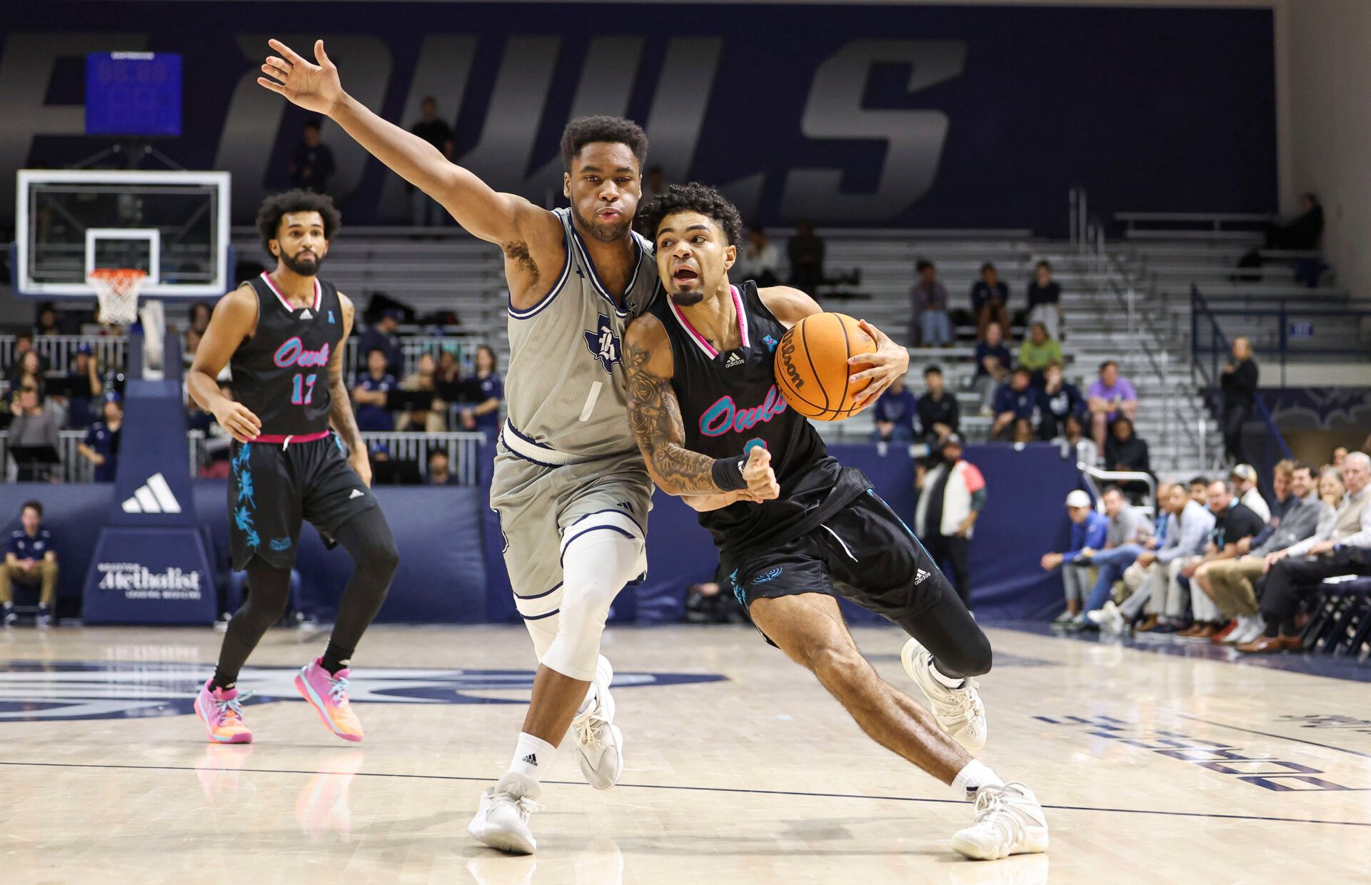 Florida Atlantic Owls guard Nick Boyd (2) drives with the ball as Rice Owls guard Noah Shelby (1) defends during the first half at Tudor Fieldhouse.