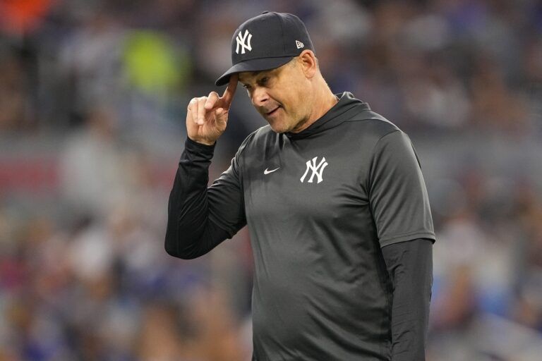 New York Yankees manager Aaron Boone walks to the dug out after making a pitching change against the Toronto Blue Jays during the fifth inning at Rogers Centre.