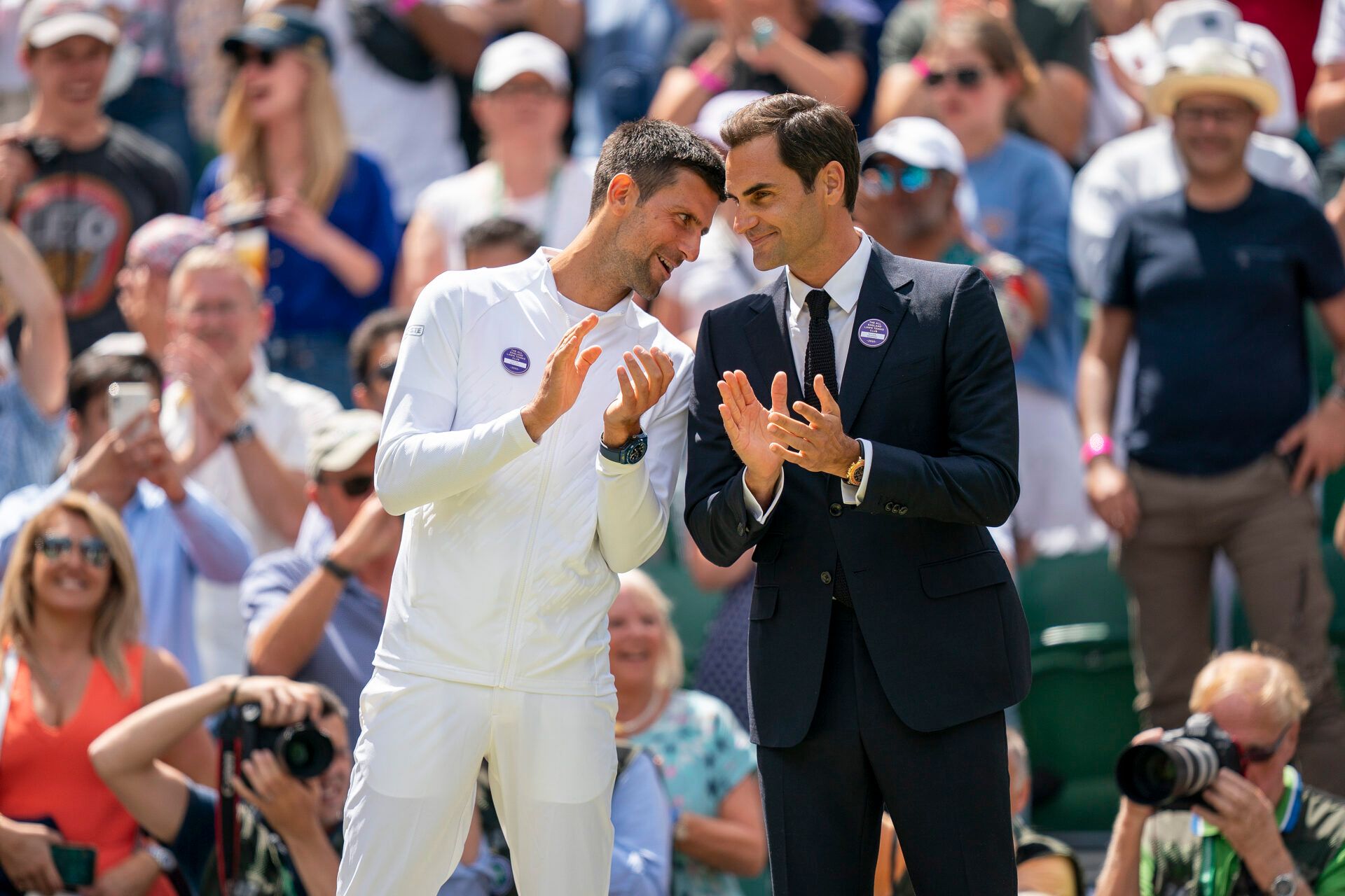 Novak Djokovic booked his place in the Wimbledon quarterfinals with Roger Federer watching him from the royal box at Centre Court.