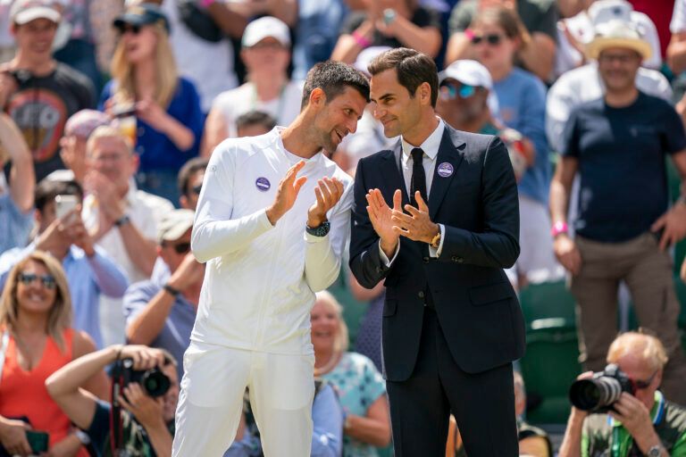 Novak Djokovic booked his place in the Wimbledon quarterfinals with Roger Federer watching him from the royal box at Centre Court.