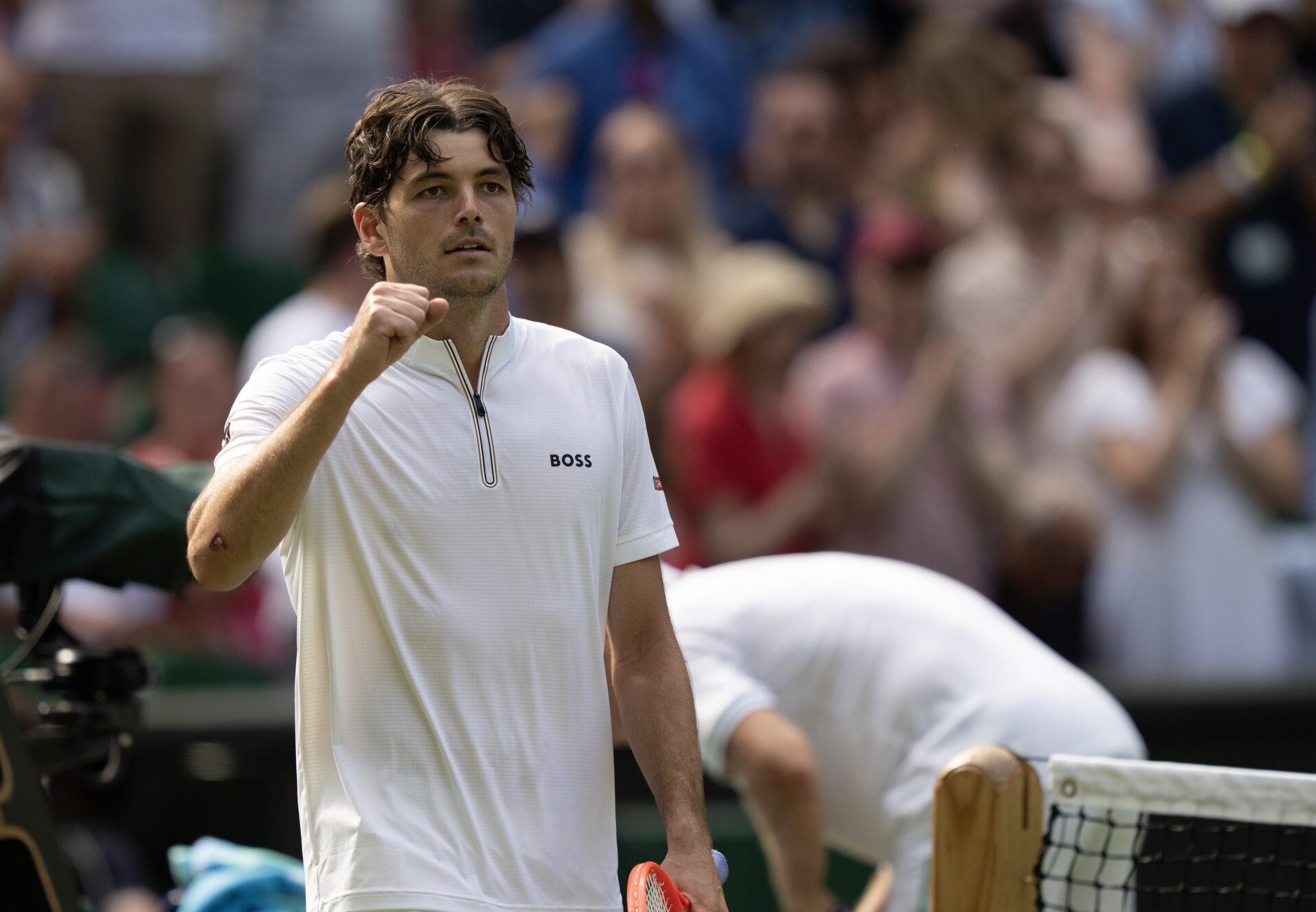 Taylor Fritz of the United States celebrates winning his match against Alejandro Davidovich Fokina of Spain on day five at the All England Lawn Tennis and Croquet Club.