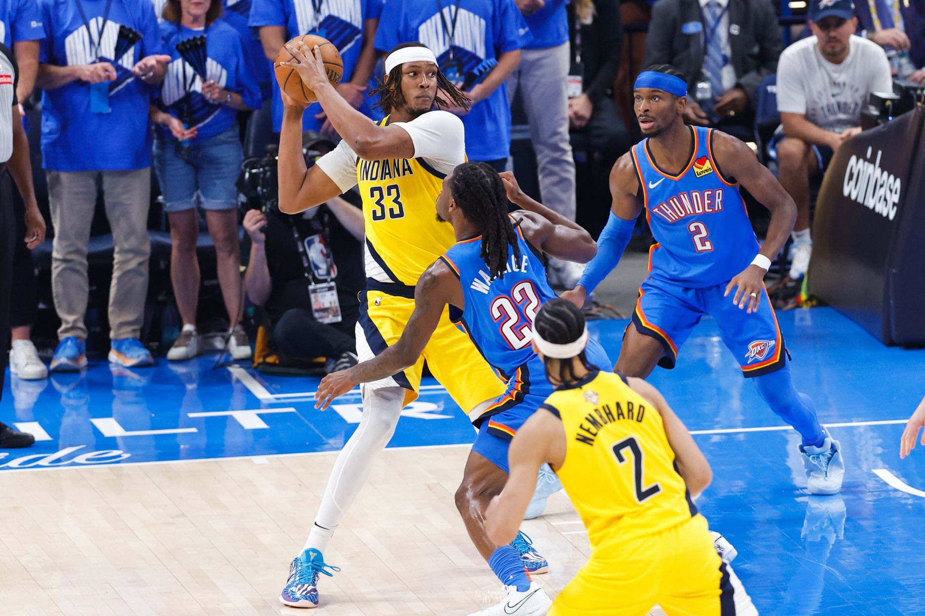 Indiana Pacers center Myles Turner (33) looks to pass while Oklahoma City Thunder guard Cason Wallace (22) defends during the first half of game seven of the 2025 NBA Finals at Paycom Center.