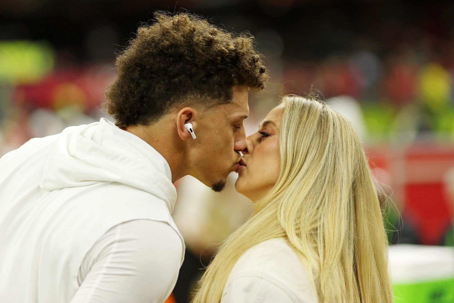Kansas City Chiefs quarterback Patrick Mahomes (15) kisses his wife Brittany Mahomes before Super Bowl LIX between the Philadelphia Eagles and the Kansas City Chiefs at Caesars Superdome.