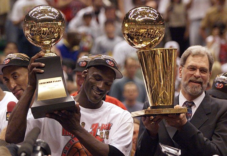 Michael Jordan holds the MVP trophy and coach Phil Jackson holds the championship trophy after the Bulls beat the Jazz to win their sixth title in 1998.

Xxx C03 Phil Jackson 17 S Ut