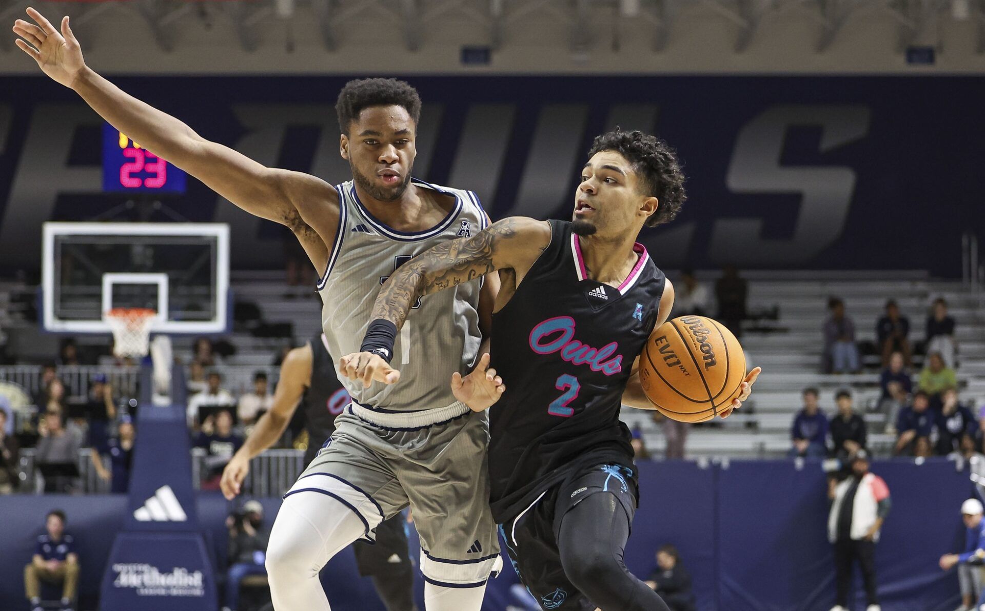Florida Atlantic Owls guard Nick Boyd (2) drives with the ball as Rice Owls guard Noah Shelby (1) defends during the first half at Tudor Fieldhouse.