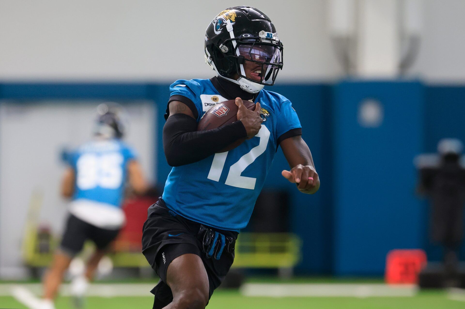 Jacksonville Jaguars wide receiver Travis Hunter (12) runs the ball during the 10th organized team activity at Miller Electric Center Wednesday, June 4, 2025 in Jacksonville, Fla. [Corey Perrine/Florida Times-Union]
