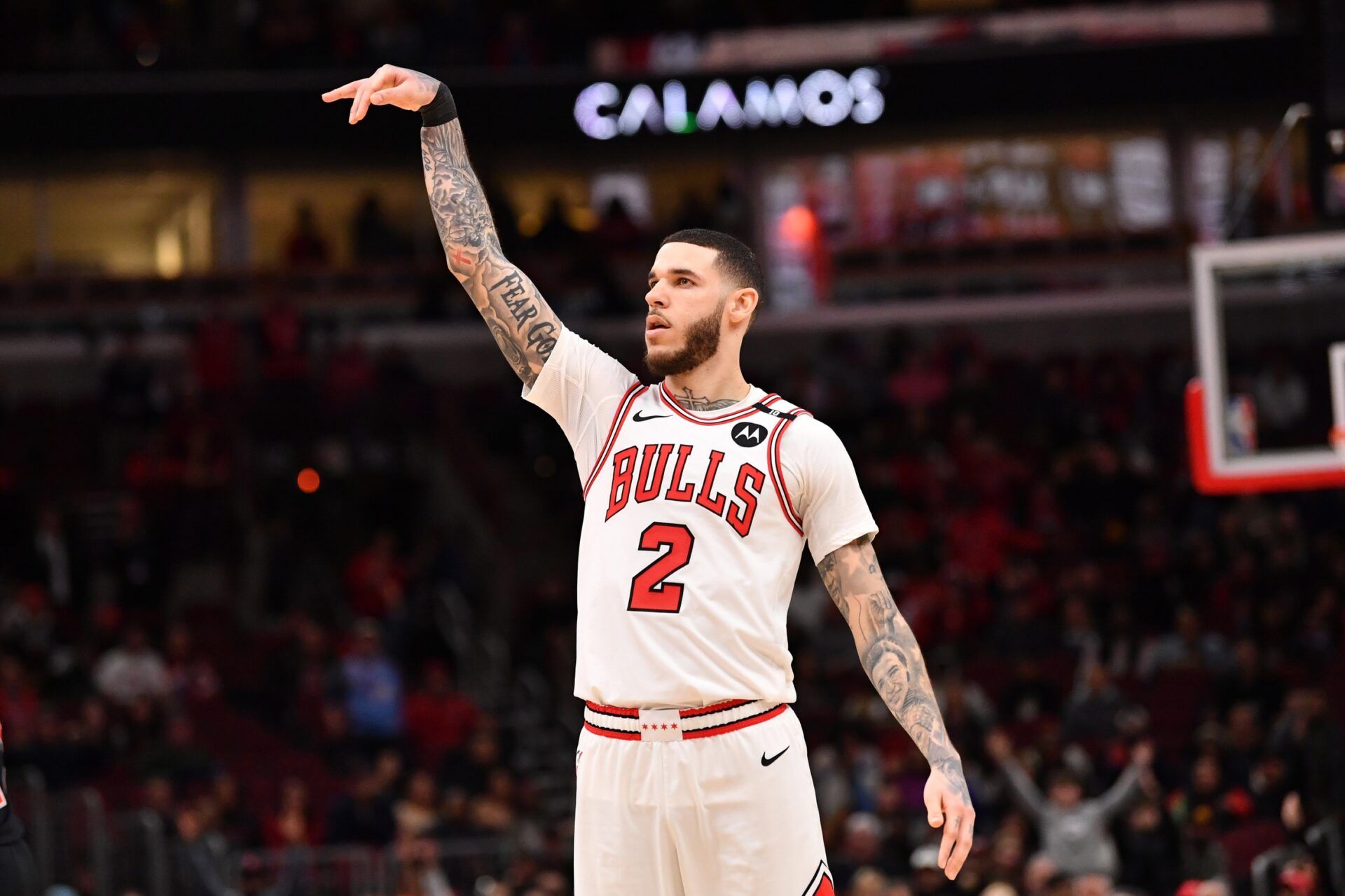 Chicago Bulls forward Lonzo Ball (2) hits a three point shot against Toronto Raptors guard Jamal Shead (23) during overtime at the United Center.