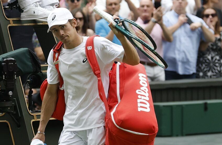 Alex de Minaur (AUS) waves to the crowd while leaving the court after his match against Novak Djokovic (SRB)(not pictured) on day eight of The Championships Wimbledon 2025 at All England Lawn Tennis and Croquet Club.