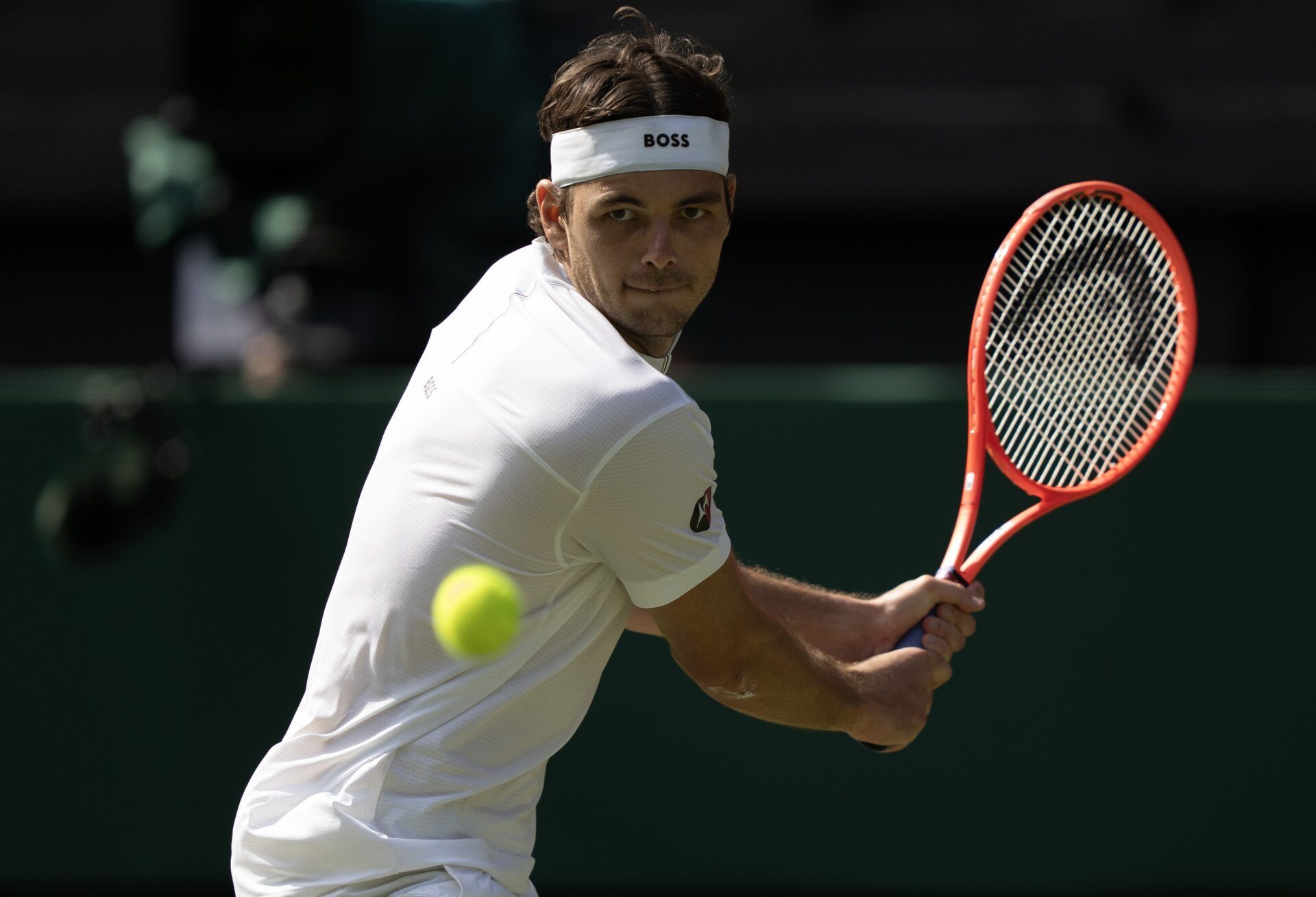 Taylor Fritz of the United States returns a shot during his match against Alejandro Davidovich Fokina of Spain on day five at the All England Lawn Tennis and Croquet Club.