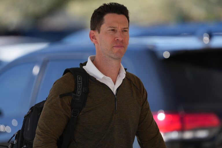 Chicago Cubs assistant general manager Craig Breslow arrives during a spring training workout at Sloan Park.