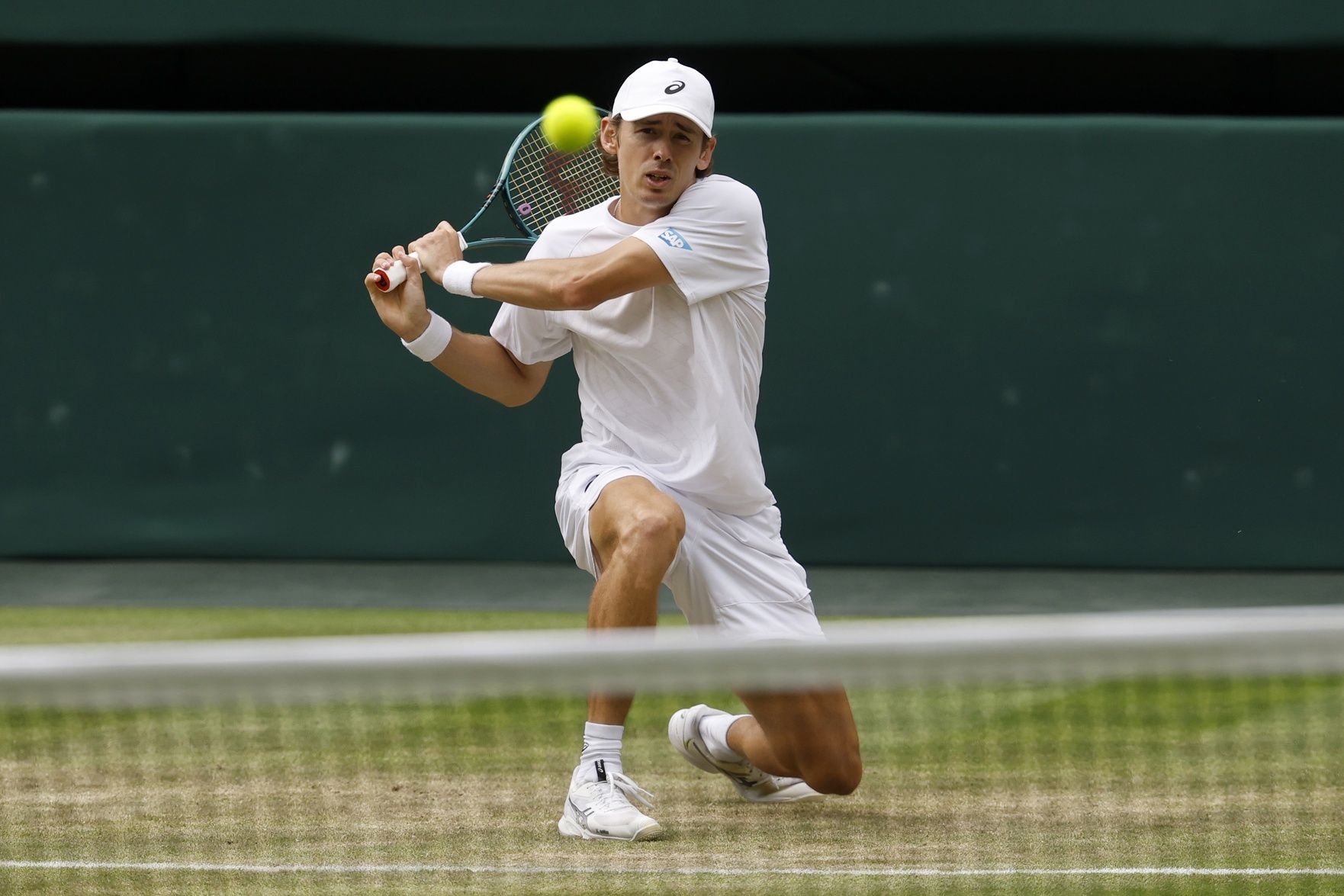 Alex de Minaur (AUS) hits a backhand against Novak Djokovic (SRB)(not pictured) on day eight of The Championships Wimbledon 2025 at All England Lawn Tennis and Croquet Club.