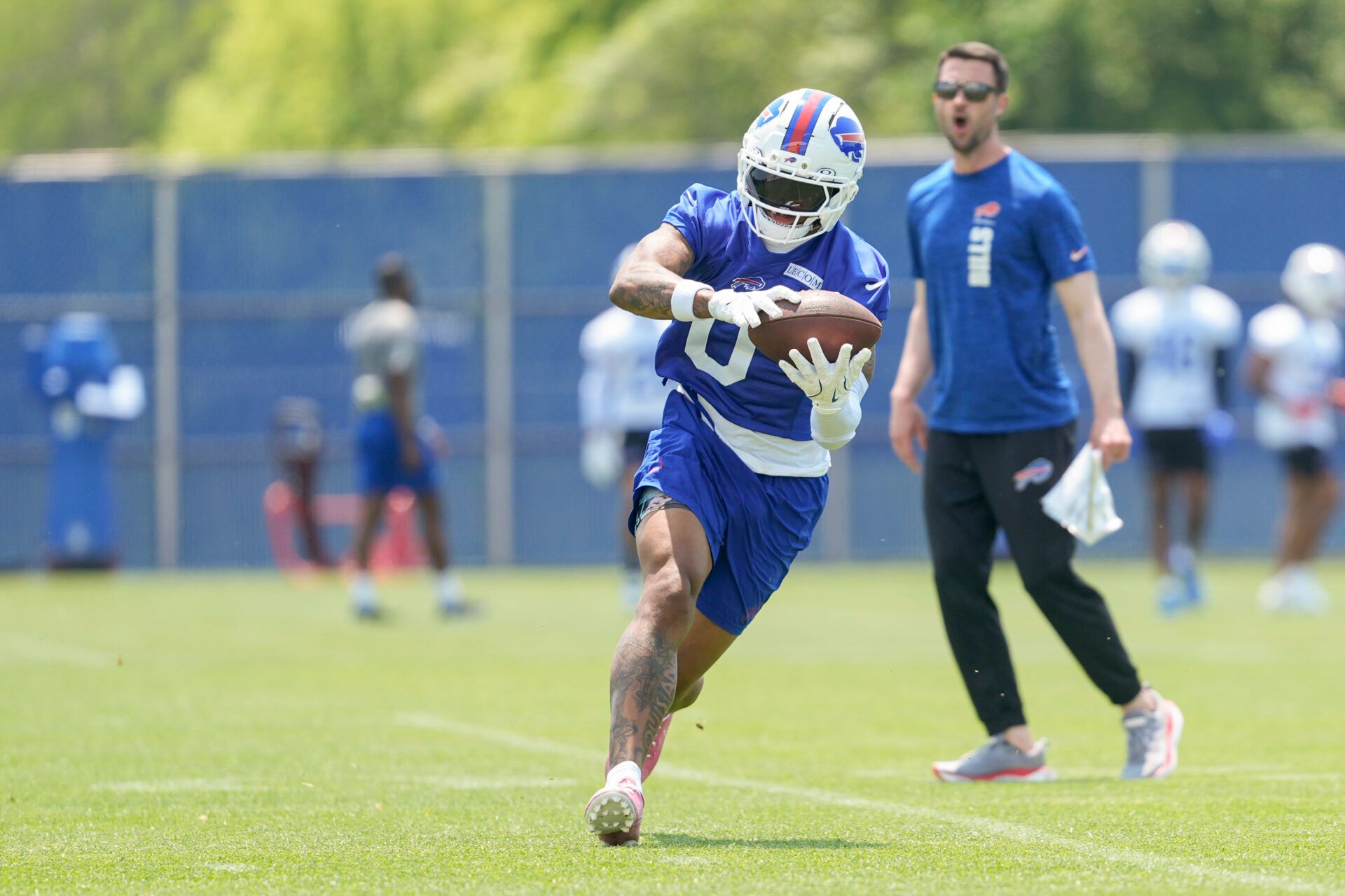 Buffalo Bills wide receiver Keon Coleman (0) makes a catch during Minicamp at Highmark Stadium.