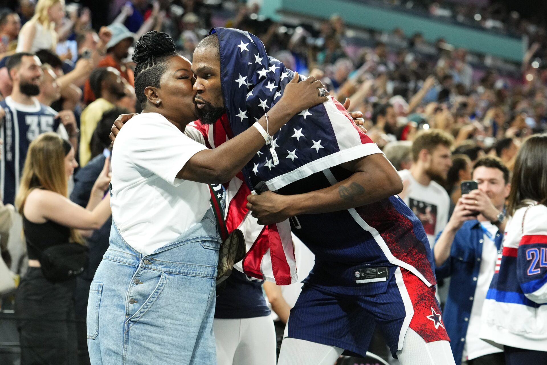 United States guard Kevin Durant (7) celebrates with his mother Wanda Durant after defeating France in the men's basketball gold medal game during the Paris 2024 Olympic Summer Games at Accor Arena.