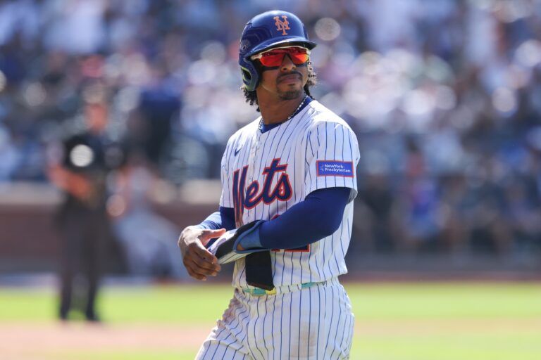 New York Mets shortstop Francisco Lindor (12) walks off the field after being doubled off of first base on a fly out by right fielder Juan Soto (22) during the seventh inning against the New York Yankees at Citi Field.