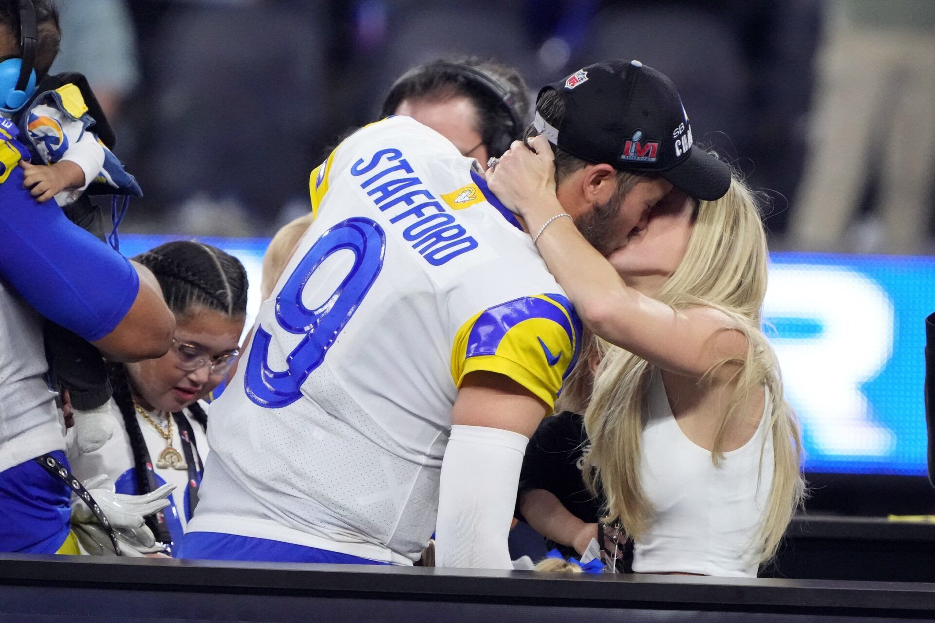 Los Angeles Rams quarterback Matthew Stafford (9) celebrates with his wife Kelly Stafford after defeating the Cincinnati Bengals in Super Bowl LVI at SoFi Stadium.