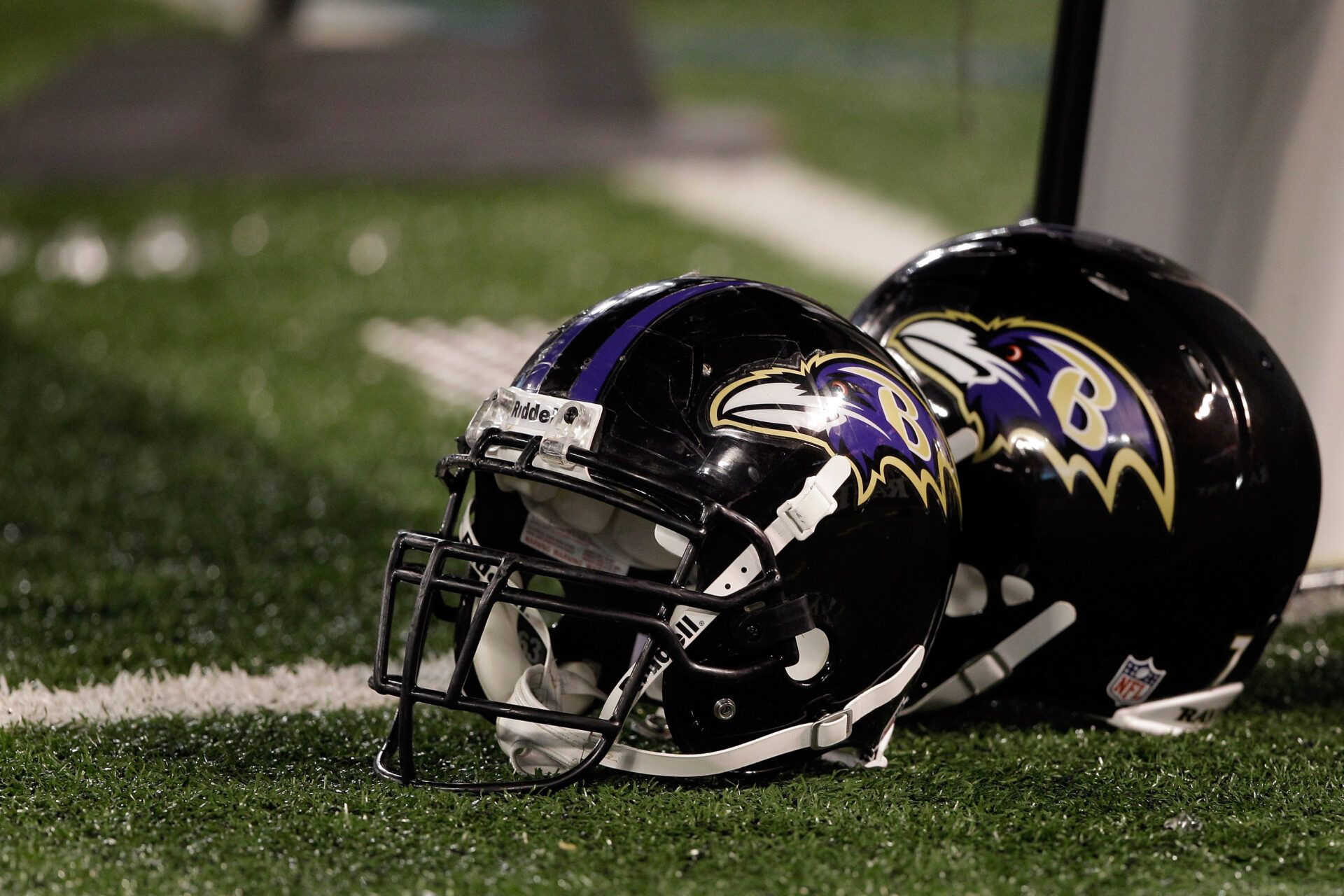 BALTIMORE, MD - AUGUST 25: A pair of Baltimore Ravens helmets sit on the sidelines during the Ravens game against the Washington Redskins at M&T Bank Stadium on August 25, 2011 in Baltimore, Maryland.  (Photo by Rob Carr/Getty Images)