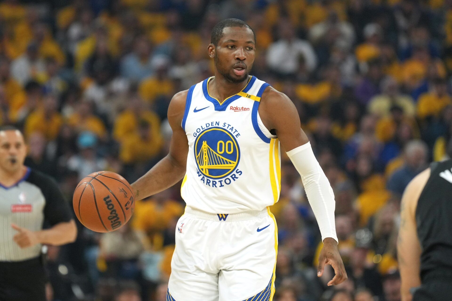 Golden State Warriors forward Jonathan Kuminga (00) handles the ball against the Houston Rockets during the first quarter of game three of first round for the 2024 NBA Playoffs at Chase Center.