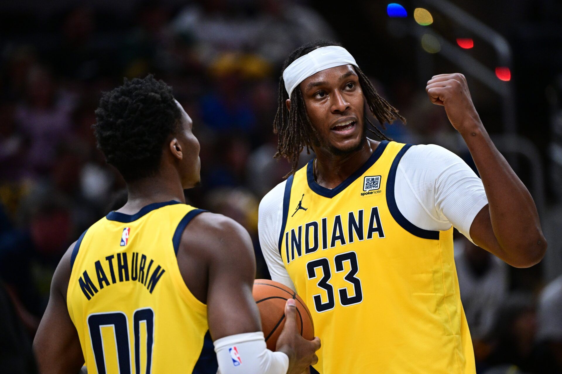 Indiana Pacers center Myles Turner (33) talks with guard Bennedict Mathurin (00) during the second half of the game against the Philadelphia 76ers at Gainbridge Fieldhouse.