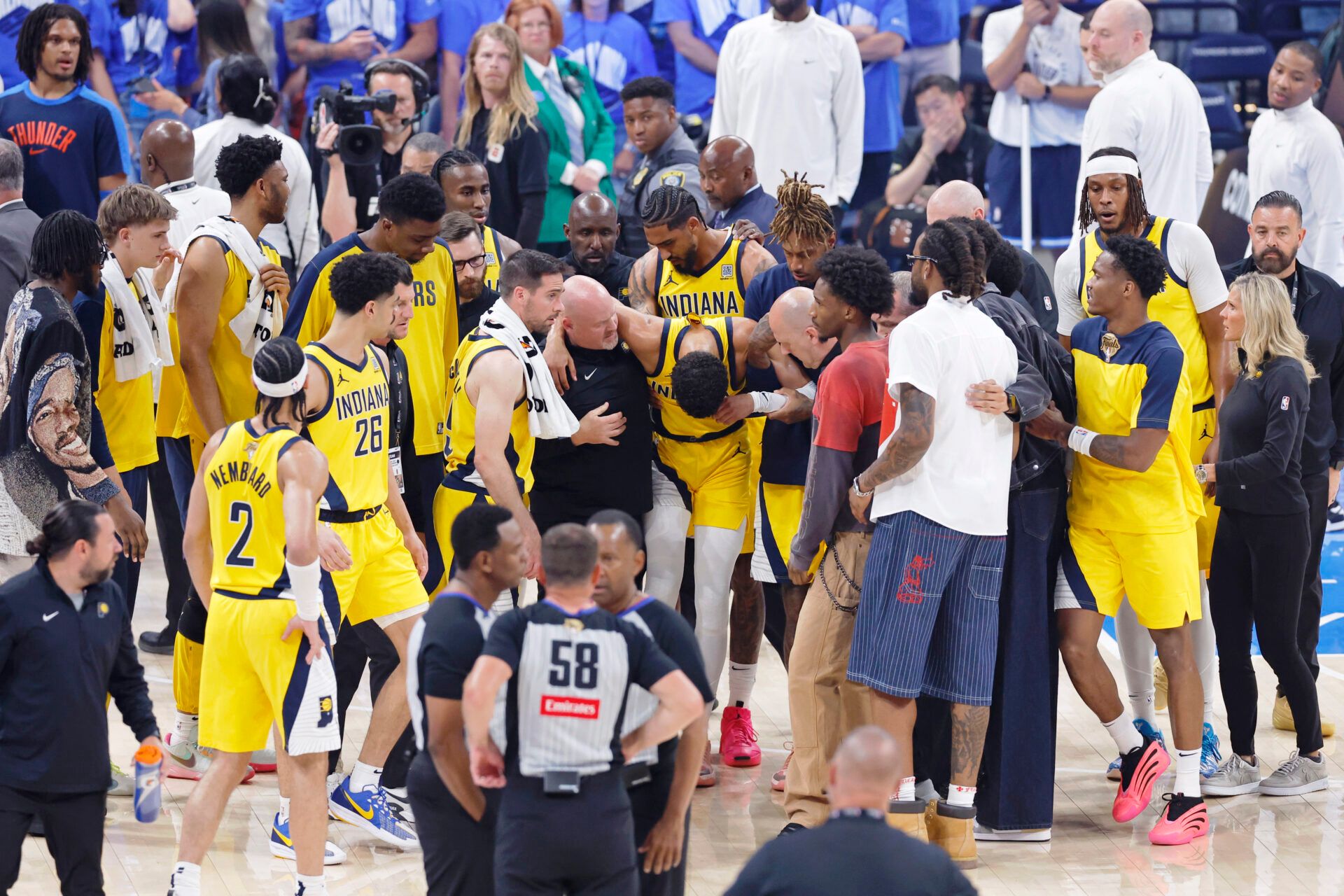 Indiana Pacers guard Tyrese Haliburton (0) is assisted after an apparent injury following a play against the Oklahoma City Thunder during the first half of game seven of the 2025 NBA Finals at Paycom Center.