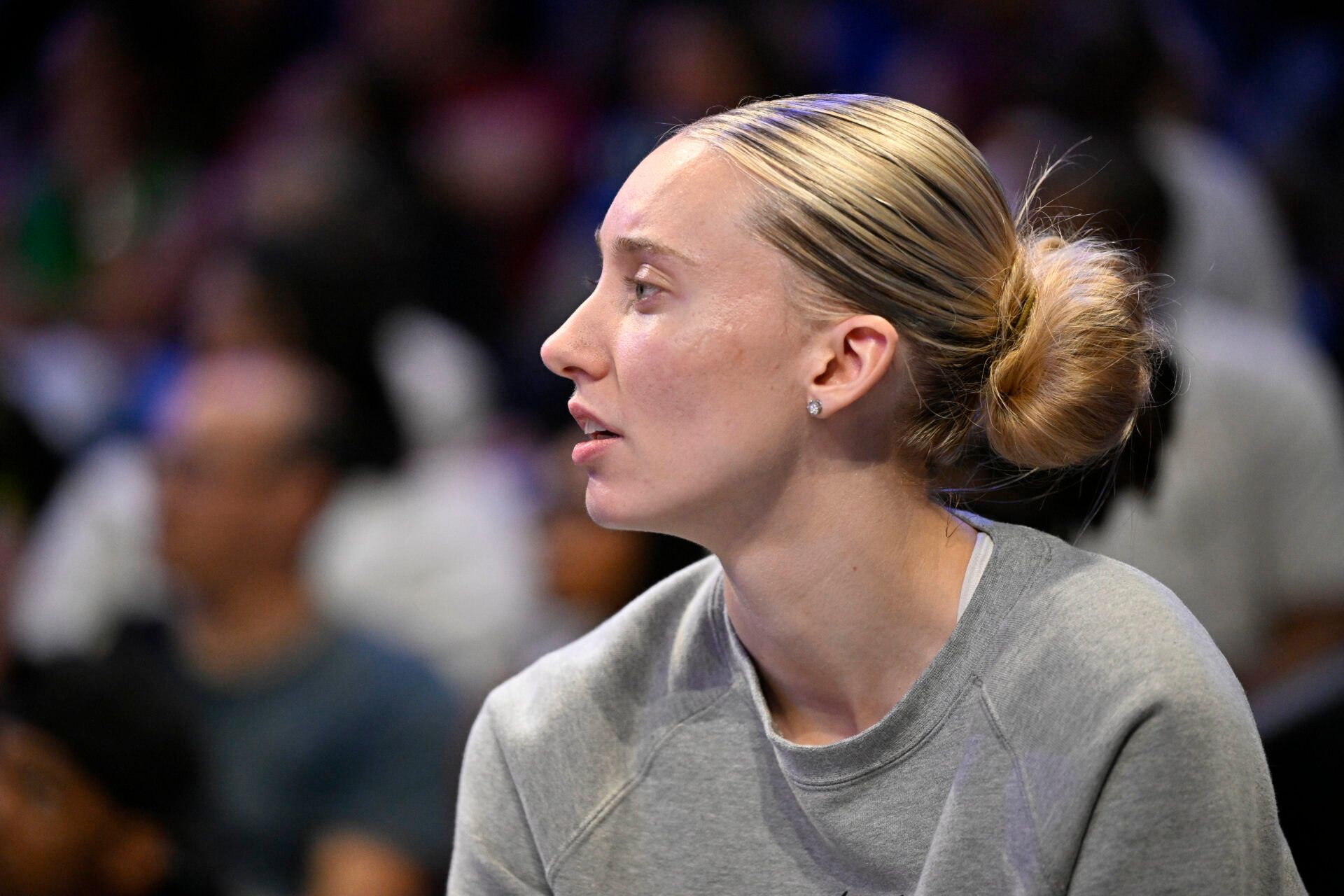 Dallas Wings guard Paige Bueckers (5) looks on from the team bench during the second half against the Washington Mystics at College Park Center.