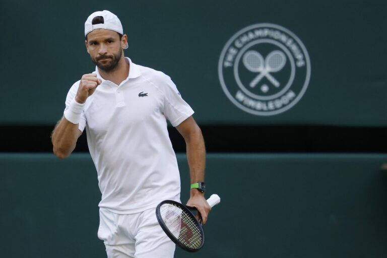 Grigor Dimitrov (BUL) reacts after winning the second set against Jannik Sinner (ITA)(not pictured) on day eight of The Championships Wimbledon 2025 at All England Lawn Tennis and Croquet Club.